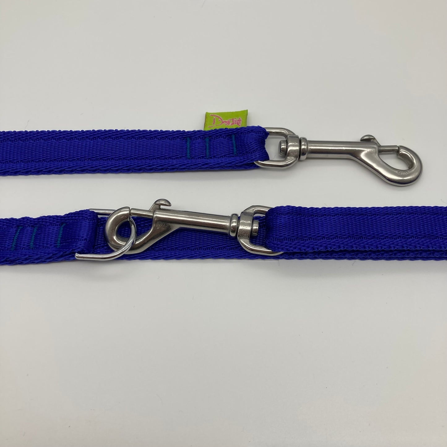 blue multifunctional leash in size small, showing the 2 stainless steel hooks and the applegreen label with DogTools logo on it