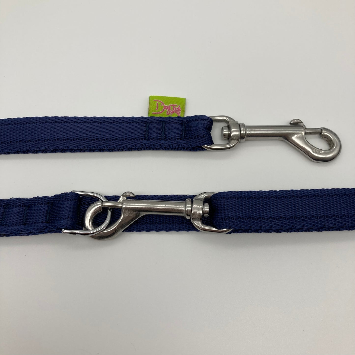 dark blue multifunctional leash in size small, showing the 2 stainless steel hooks and the applegreen label with DogTools logo on it