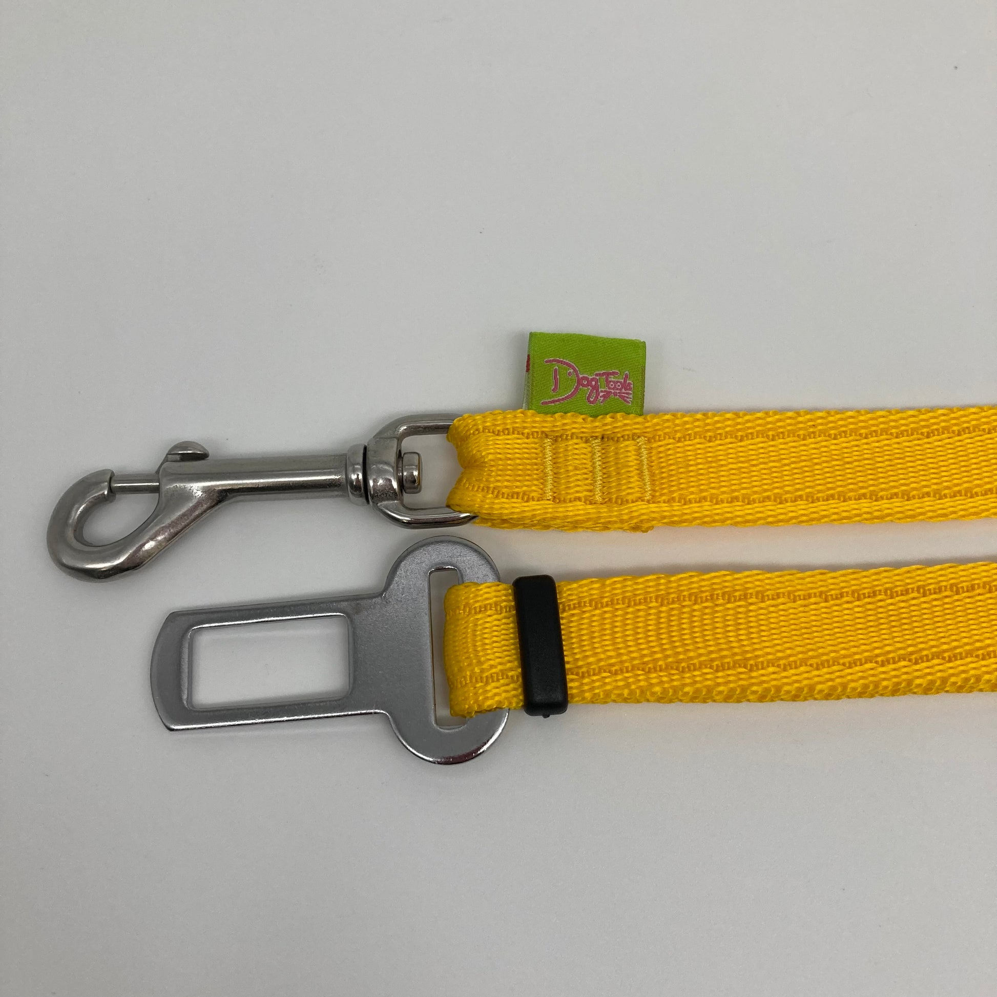 yellow car safety belt, showing the stainless steel hook and the stainless steel buckle, applegreen label with the DogTools logo