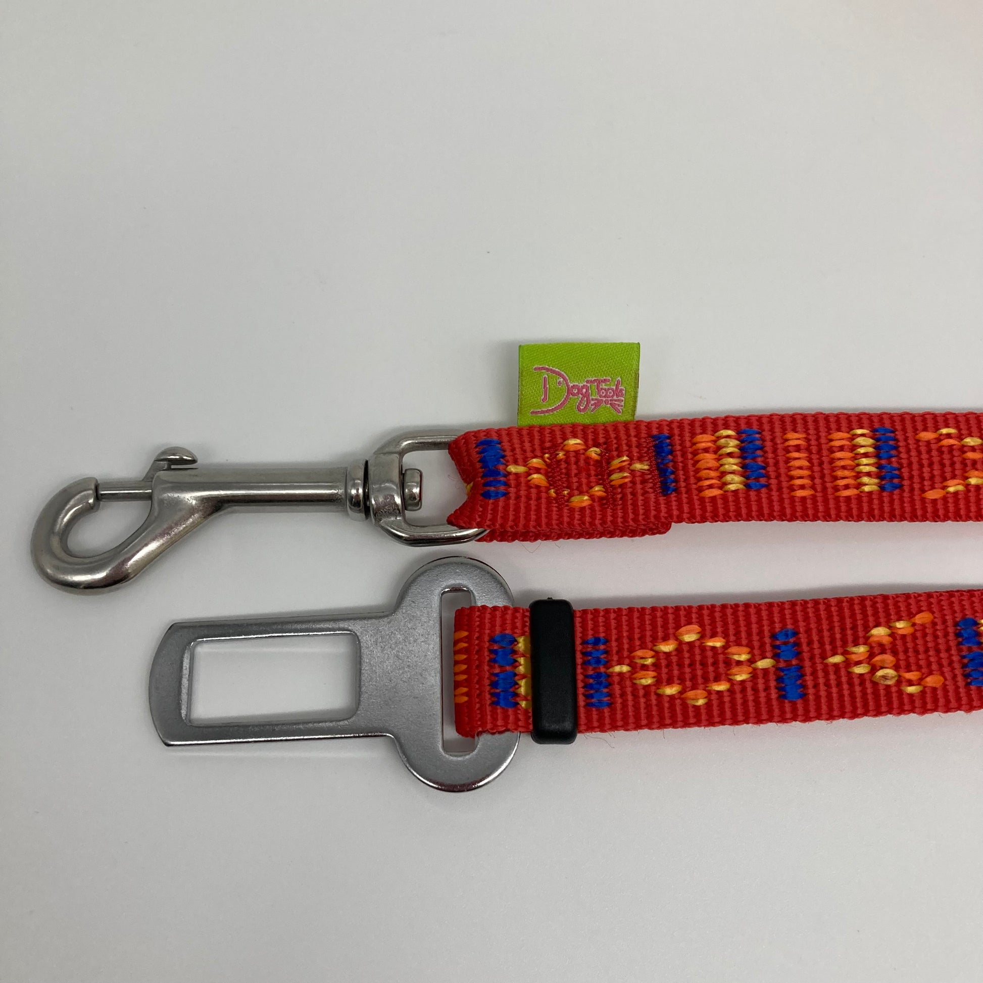 red Stitch (red fabric with print in 3 colors, yellow, orange and blue) car safety belt, showing the stainless steel hook and the stainless steel buckle, applegreen label with the DogTools logo