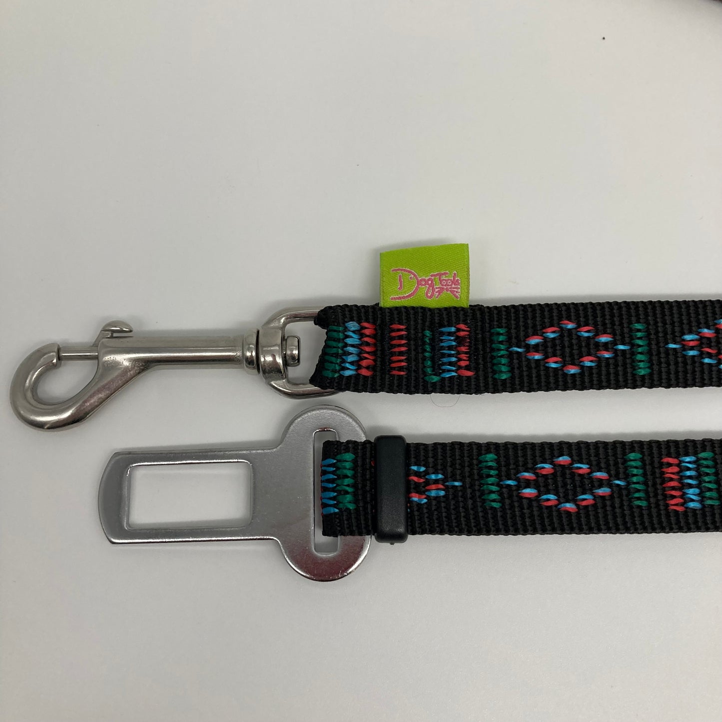 black Stitch (black fabric with print in 3 colors, red, light blue and green) car safety belt, showing the stainless steel hook and the stainless steel buckle, applegreen label with the DogTools logo