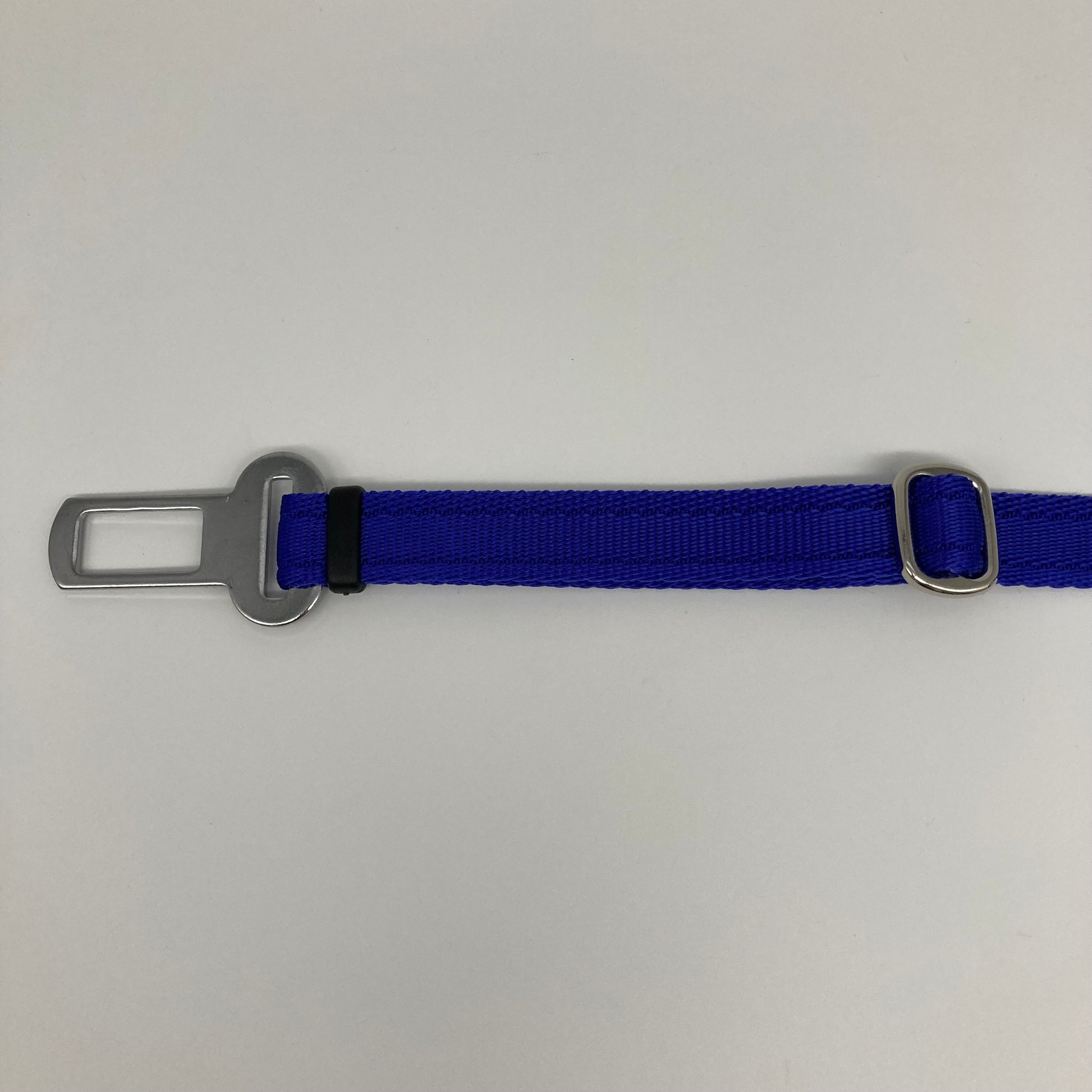 blue car safety belt, showing the stainless steel buckle and the stainless steel clasp to adjust the length of the belt