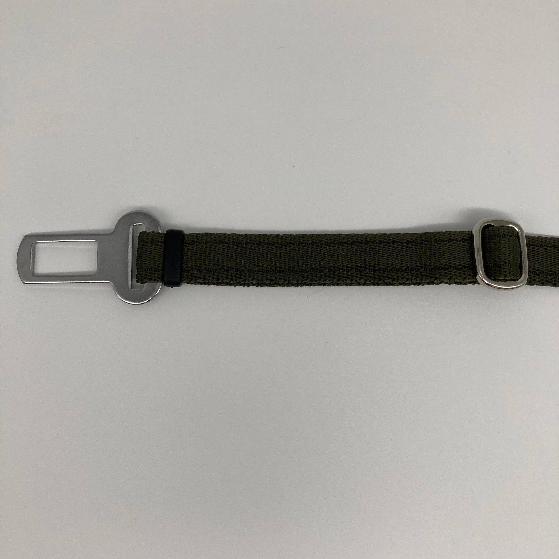 olive green car safety belt, showing the stainless steel buckle and the stainless steel clasp to adjust the length of the belt