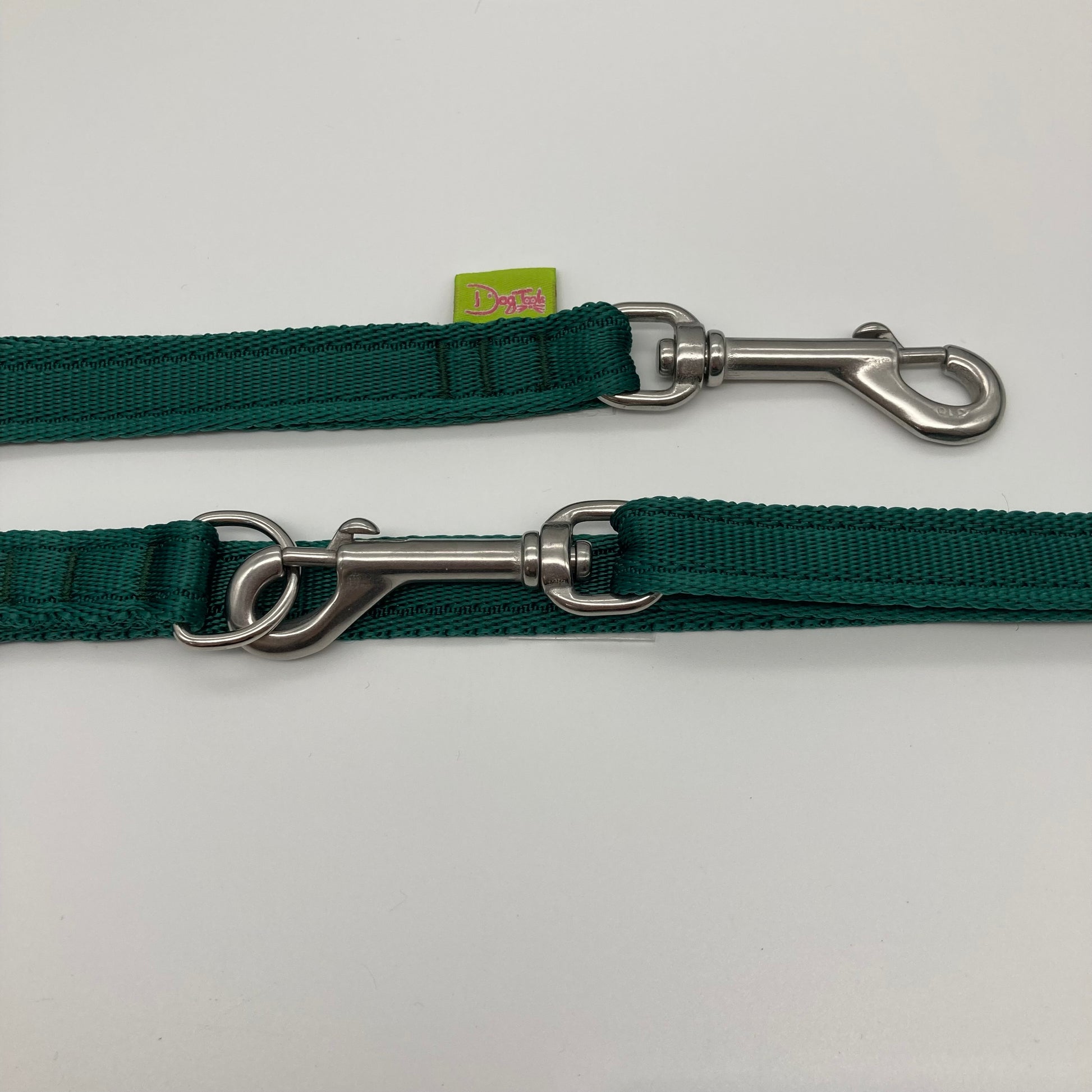 green multifunctional leash in size small, showing the 2 stainless steel hooks and the applegreen label with DogTools logo on it
