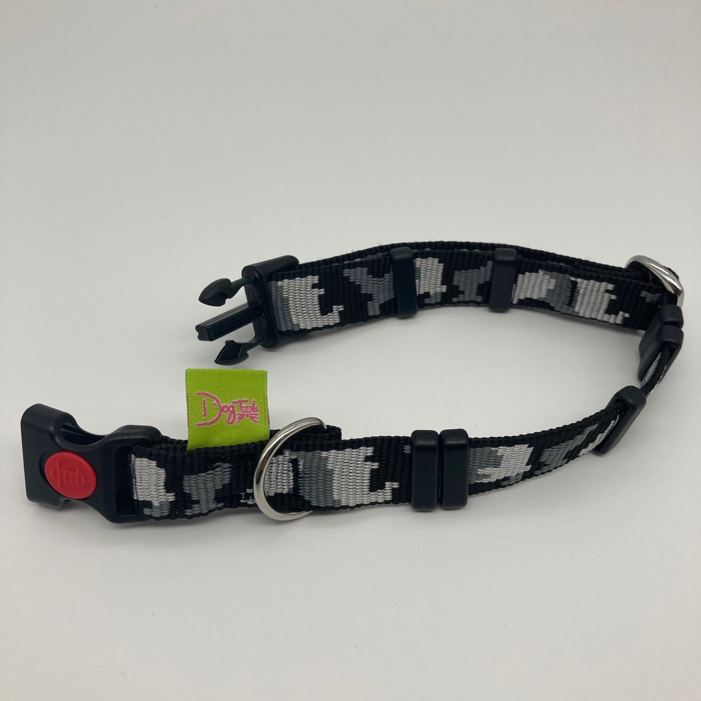 army grey (army print in 3 colors, dark grey, light grey and black) collar displayed on a white surface, unlocked, showing the black lock, stainless steel ring, the black loops and the applegreen DogTools label