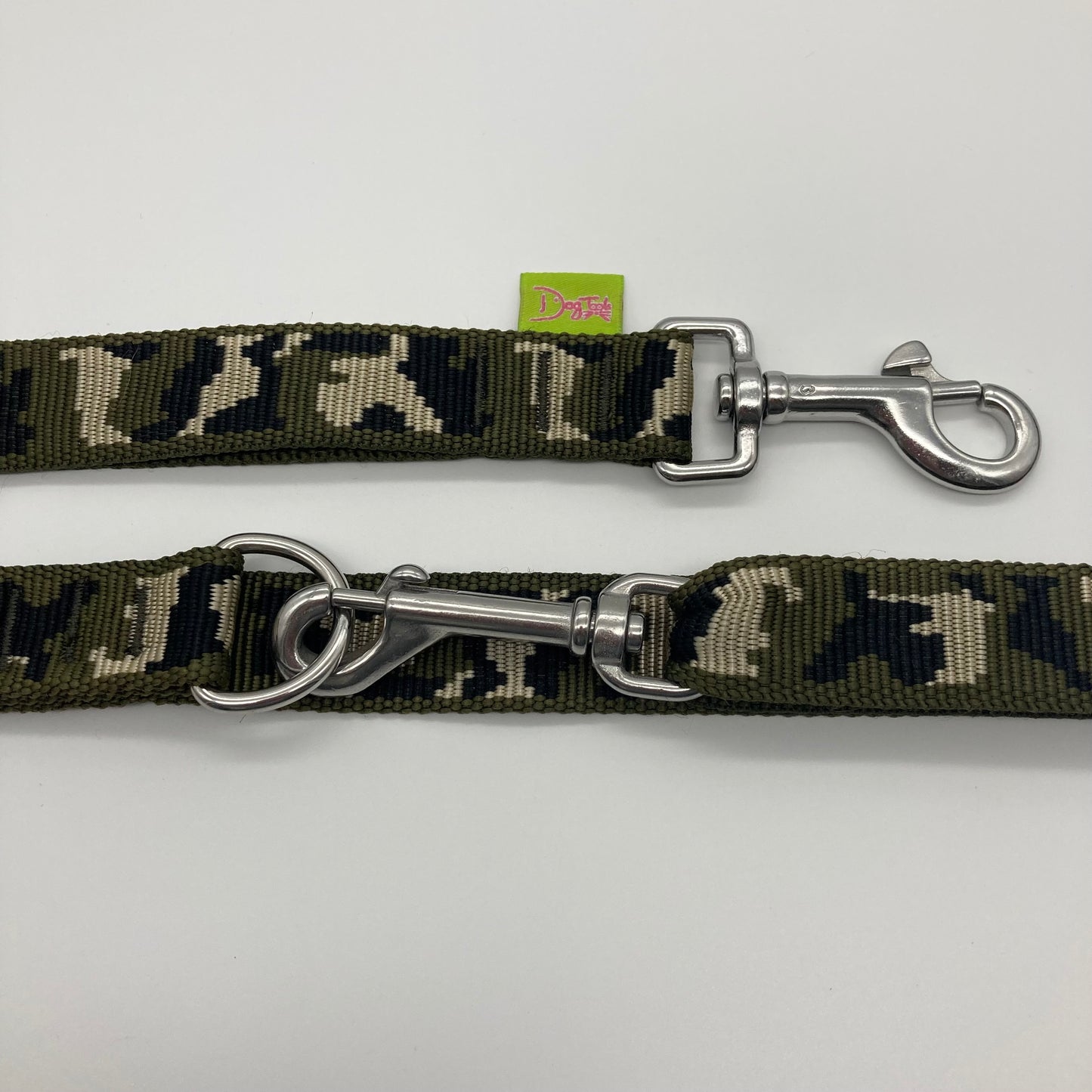 army green (army print in 3 colors, olive green, beige and black) multifunctional leash in size large, showing the 2 stainless steel hooks and the applegreen label with DogTools logo on it