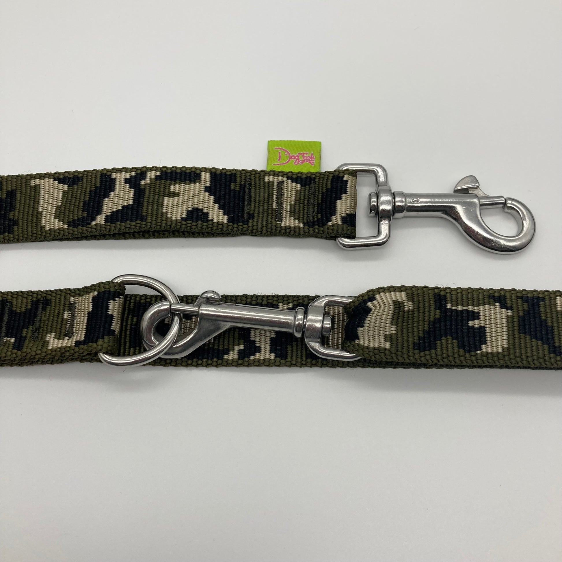 army green (army print in 3 colors, olive green, beige and black) multifunctional leash in size large, showing the 2 stainless steel hooks and the applegreen label with DogTools logo on it
