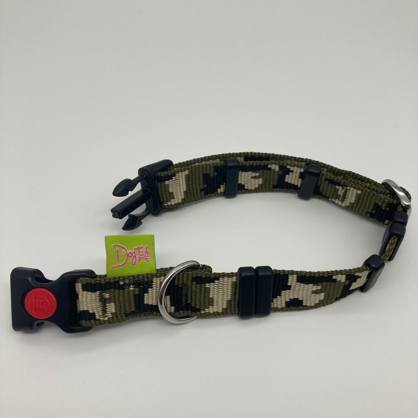 army green (army print in 3 colors, olive green, beige and black) collar displayed on a white surface, unlocked, showing the black lock, stainless steel ring, the black loops and the applegreen DogTools label