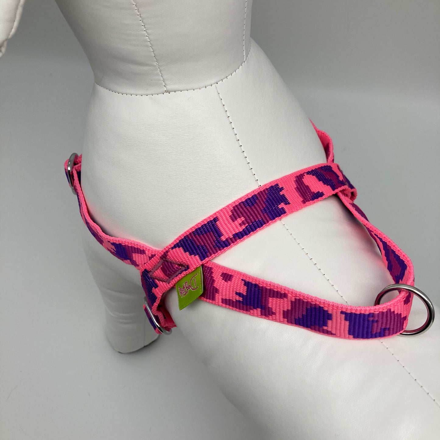 army pink (army print in 3 colors, fushia, purple and pink) harness, showing the back from above, showing the loop, the stainless steel ring and the applegreen label