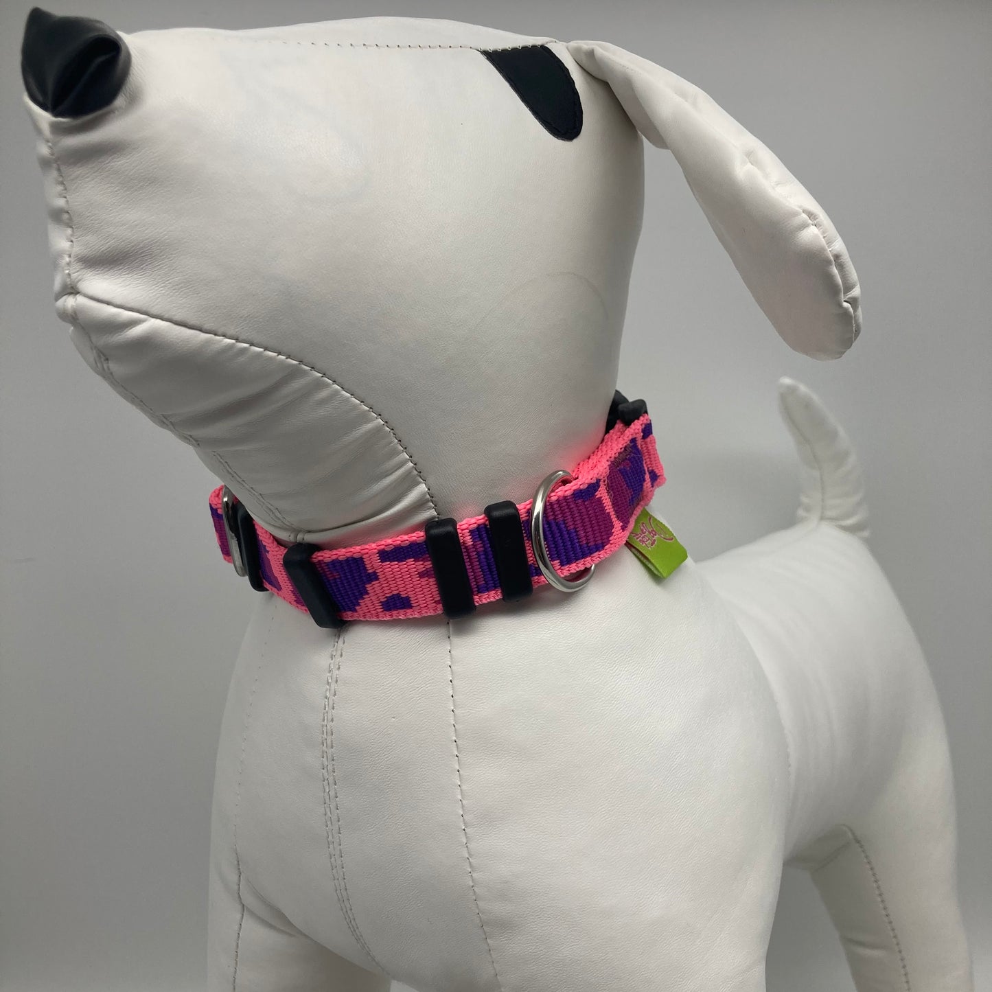 army pink (army print in 3 colors, fushia, purple and pink) collar displayed on a stuffed toy (dog), from the front of the dog, showing its head and torso