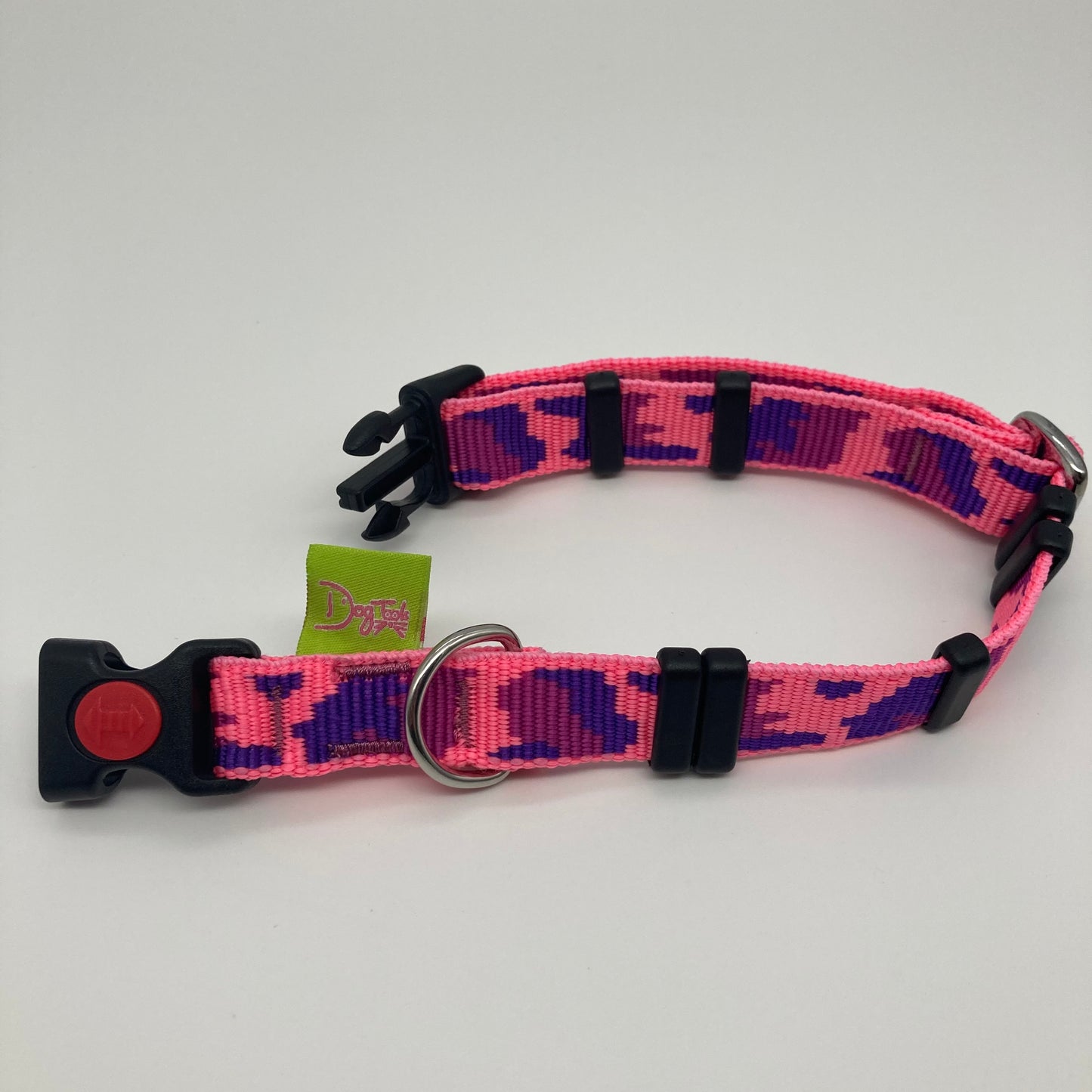 army pink (army print in 3 colors, fushia, purple and pink) collar displayed on a white surface, unlocked, showing the black lock, stainless steel ring, the black loops and the applegreen DogTools label