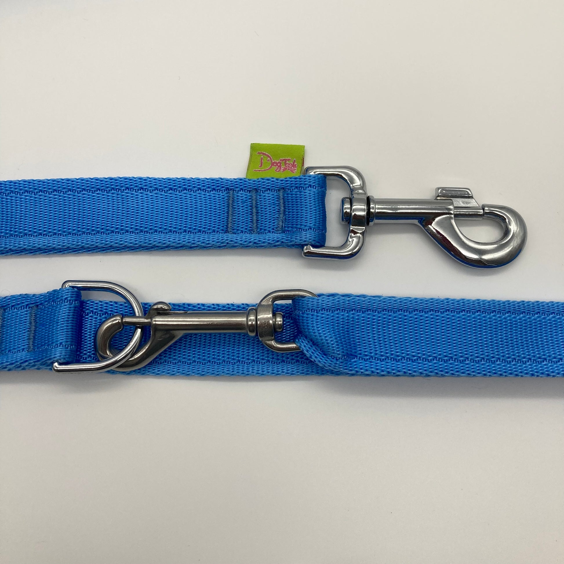 light blue multifunctional leash in size large, showing the 2 stainless steel hooks and the applegreen label with DogTools logo on it