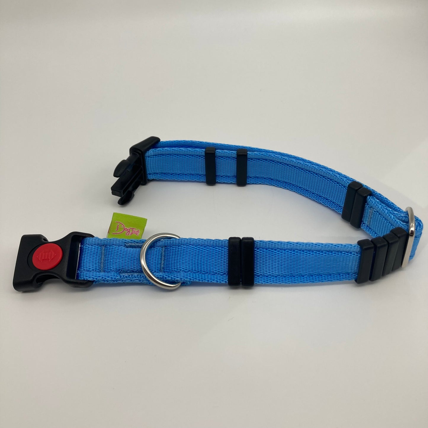 light blue collar displayed on a white surface, unlocked, showing the black lock, stainless steel ring, the black loops and the applegreen DogTools label