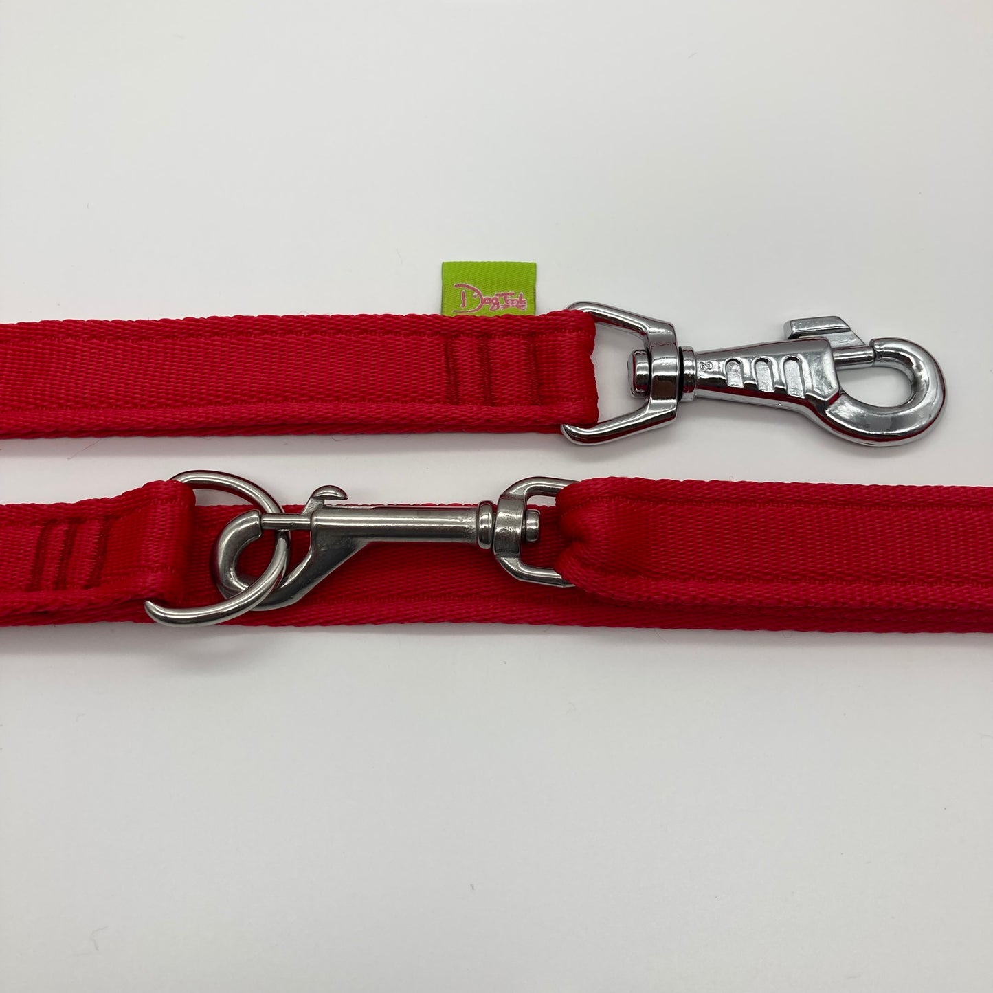 red multifunctional leash in size large, showing the 2 stainless steel hooks and the applegreen label with DogTools logo on it