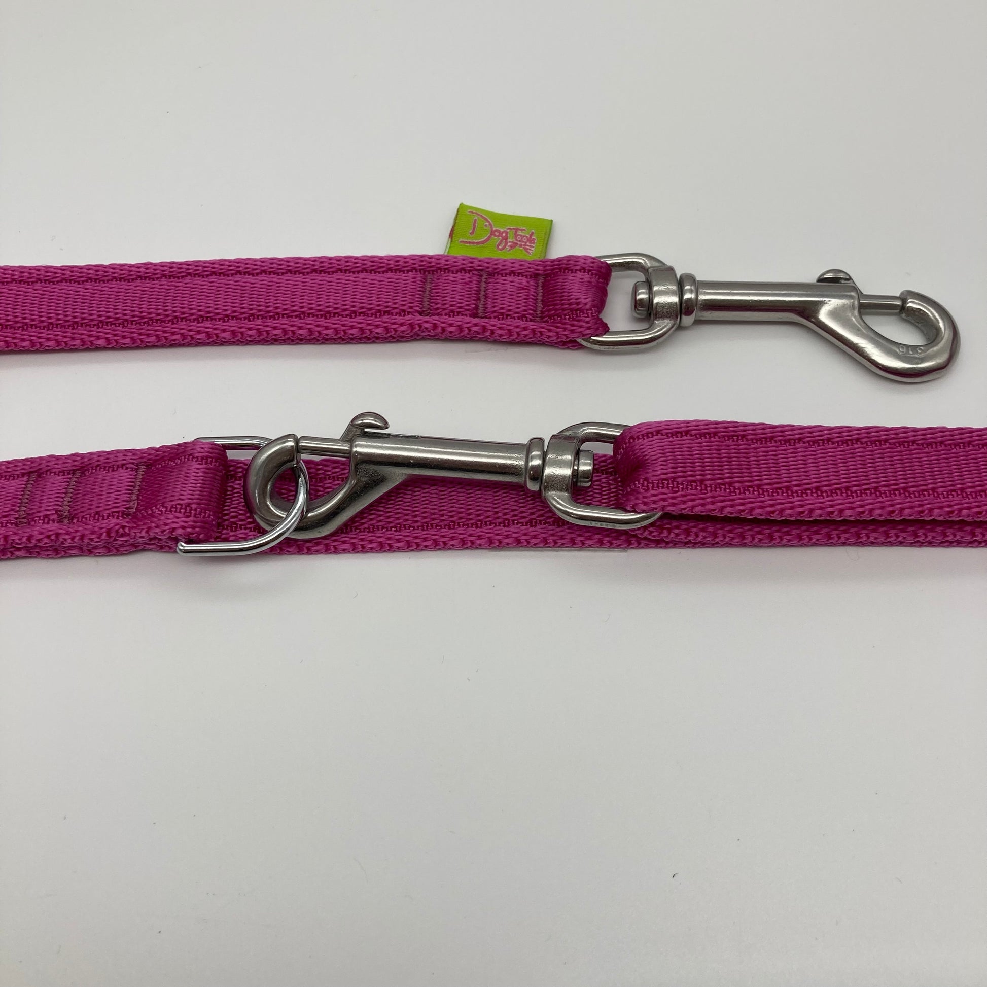 pink multifunctional leash in size small, showing the 2 stainless steel hooks and the applegreen label with DogTools logo on it