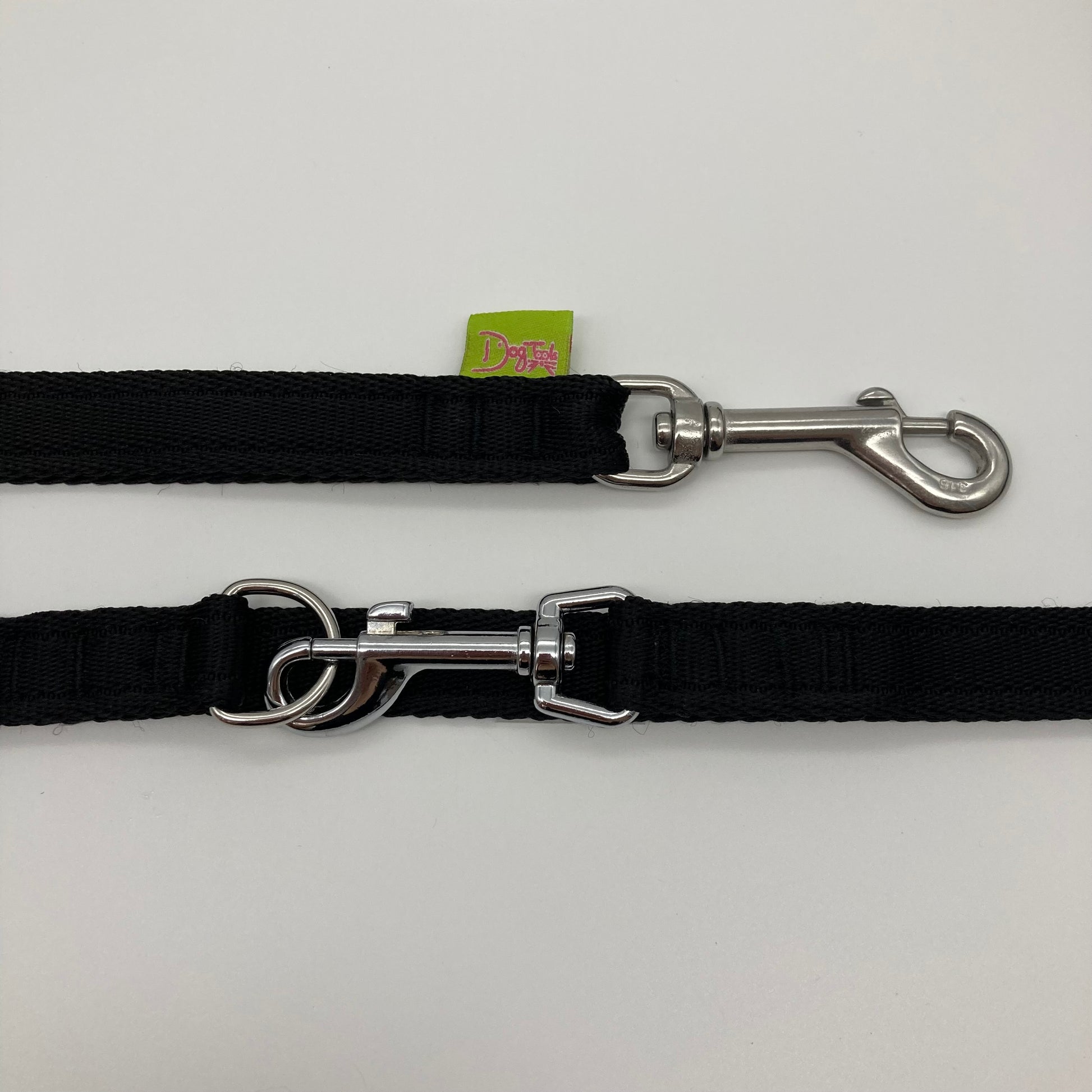 black multifunctional leash in size small, showing the 2 stainless steel hooks and the applegreen label with DogTools logo on it