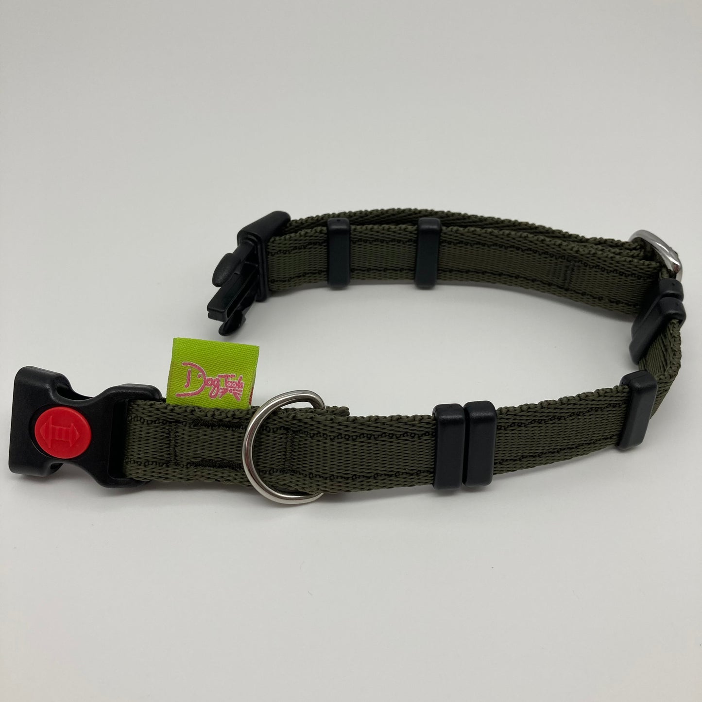 olive green collar displayed on a white surface, unlocked, showing the black lock, stainless steel ring, the black loops and the applegreen DogTools label