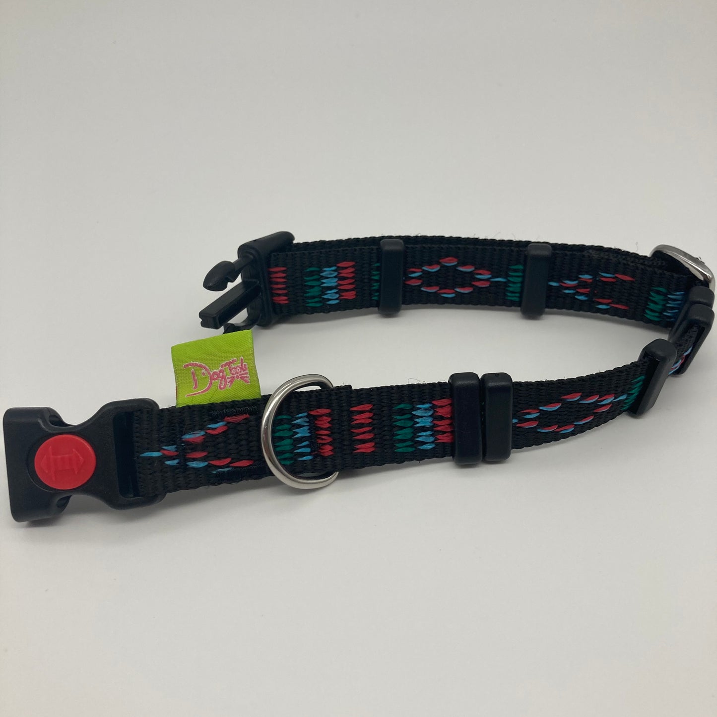 Stitch black (black fabric with print in 3 colors, red, light blue and green) collar displayed on a white surface, unlocked, showing the black lock, stainless steel ring, the black loops and the applegreen DogTools label